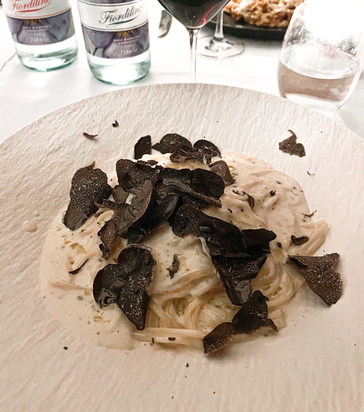 white plate with tagliolini al tartufo